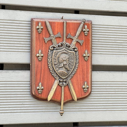 Vintage wooden wall shield with metal coat of arms, swords & fleur-de-lis used
