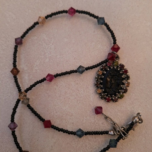 Necklace black with colorful stones and embossed face vintage like new