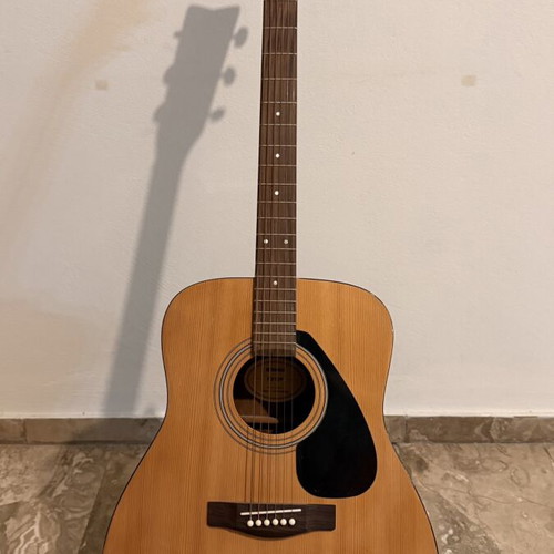 Yamaha F310 acoustic guitar like new with original case and Hercules stand