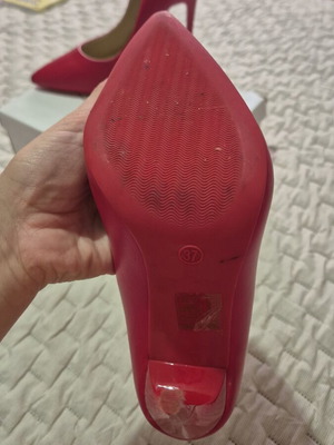Red high heel pumps
