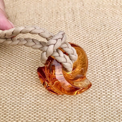 Baccarat crystal pendant like new, amber color