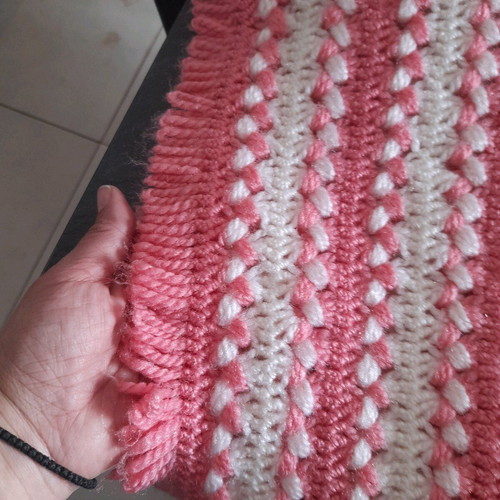 Knitted handmade crib blanket used pink white