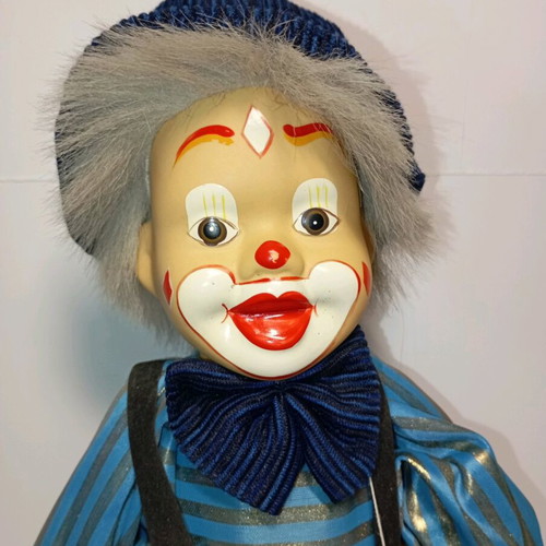 Marionette clown used with wooden control bar
