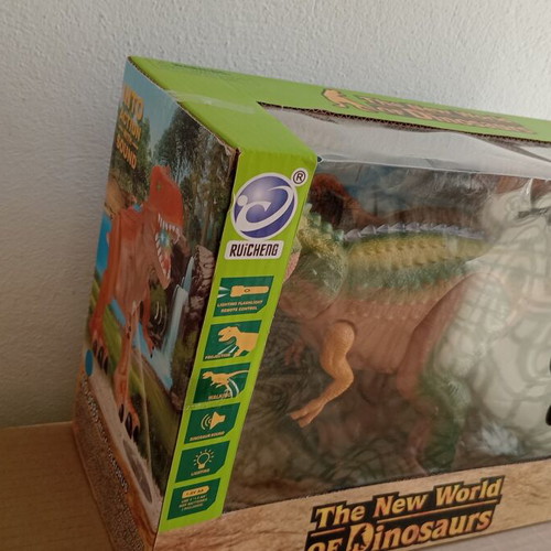 Dinosaur toy like new, in original box with minor wear