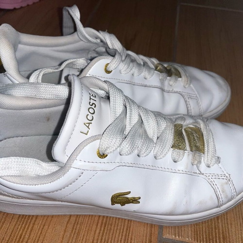 Lacoste sneakers used leather with gold details