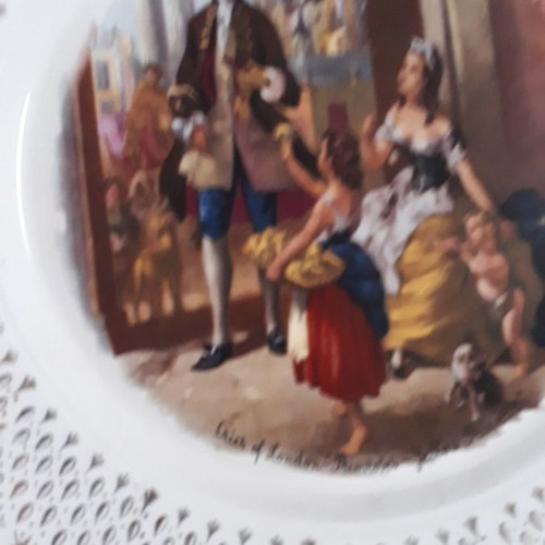 Set of four used French wall plates with gold designs 23cm
