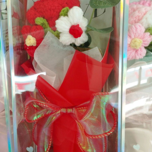 Artificial flower bouquet like new with knitted flower and plastic leaves