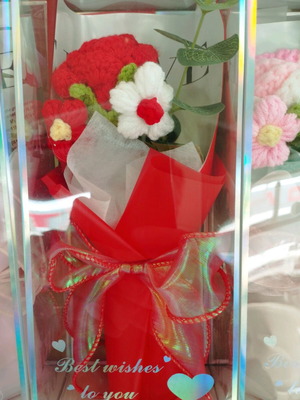 Artificial flower bouquet like new with knitted flower and plastic leaves