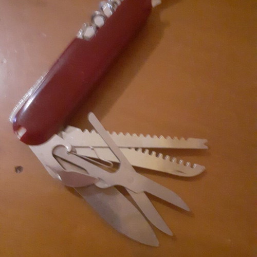 Two multitool pocket knives new with scissors and serrated blade