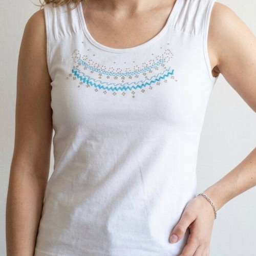 White sleeveless top used with embroidery and rhinestones size M
