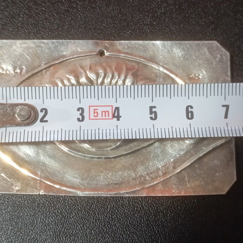 Silver votive with eye depiction used