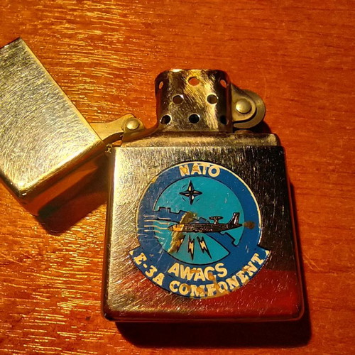 Collectible Zippo lighter 32 years old and handmade Okapi knife.