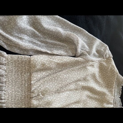 Romantic women's blouse beige used, size M with smocked waist and peplum hem