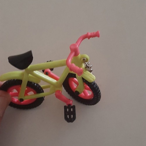 Vintage motorcycle and bicycle keychains used, colorful