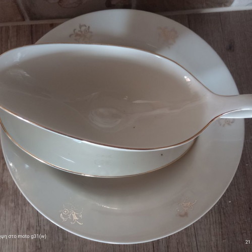 Gravy boat and deep plate used with floral patterns