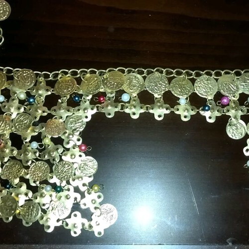Genuine Khanoumisa belt like new, adjustable, gold-colored
