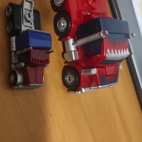 Transformers Optimus Prime figures used, both together