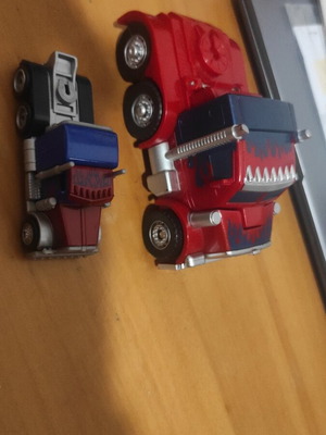 Transformers Optimus Prime figures used, both together