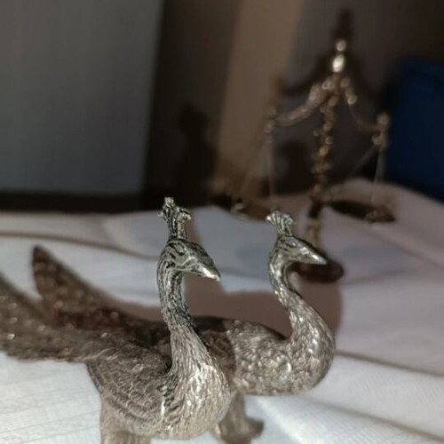 Vintage metal scale and decorative peacocks used