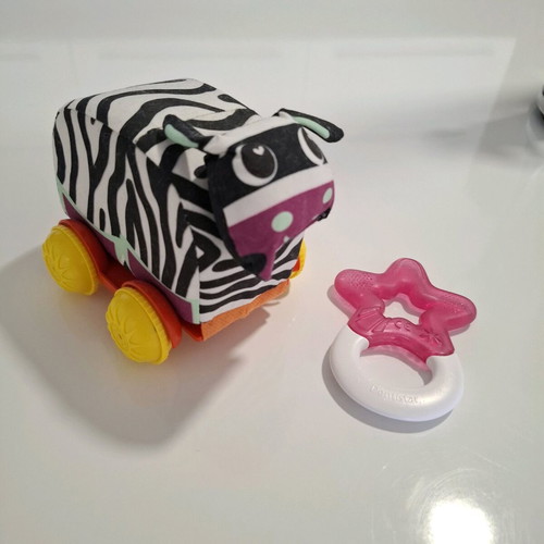 Luna fabric animal with wheels and teether star like new