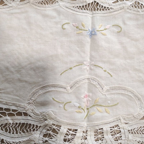 Small tablecloth used, white with lace and flowers