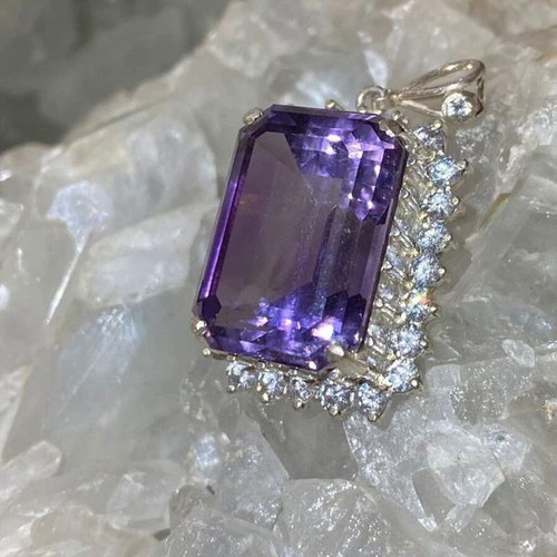 Silver pendant with large cut natural amethyst stone and moissanites
