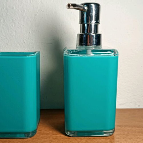 Soap dispenser and toothbrush holder used