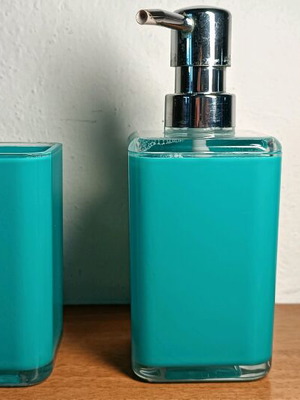 Soap dispenser and toothbrush holder used