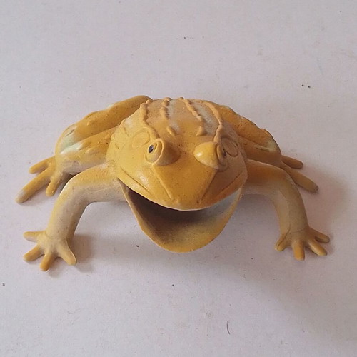 Frog figure used, orange and yellow