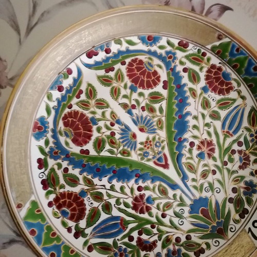 Ceramic wall plate used with gold details