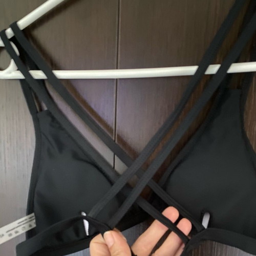 Black bikini top new with crisscross straps, size XS