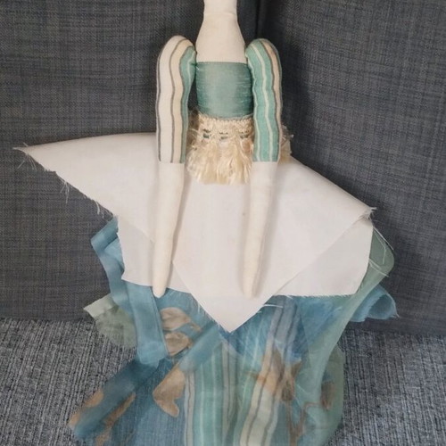 Handmade doll used with fabrics and detailed design