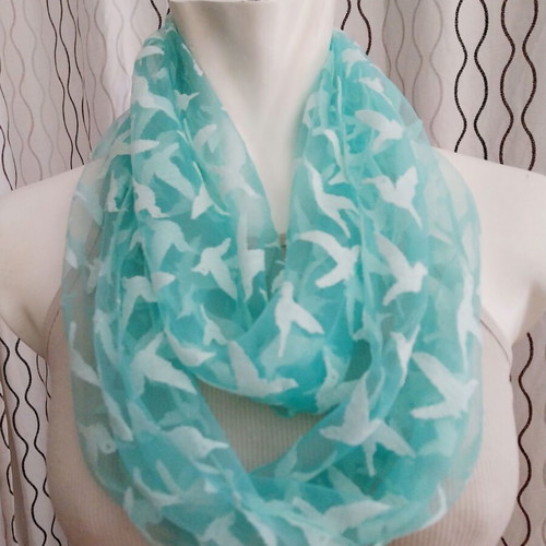 Lightweight scarf used, semi-transparent green with white hummingbirds