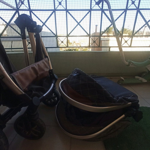 Multifunctional stroller used, foldable in two parts, beige brown gold
