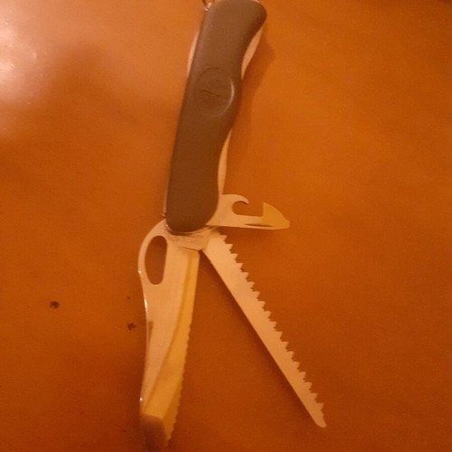 Two multitool pocket knives new with scissors and serrated blade