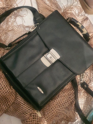 Vintage black hand bag used with visible wear