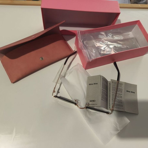 Miu Miu sunglasses women like new, black and gold