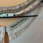 White blouse with silver details around neckline size M like new