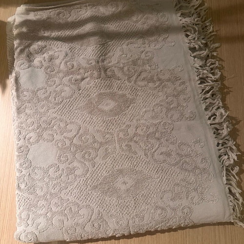 Towel like new, embossed