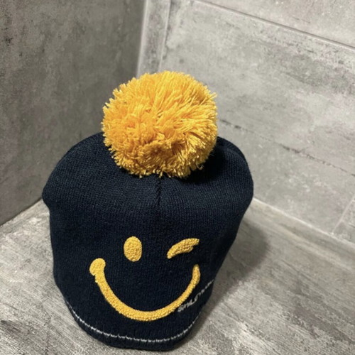 Smiley knitted hat used with sherpa lining