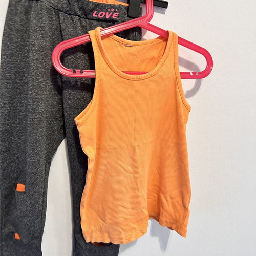 Girls' sports set with grey leggings and orange tank top, size 10
