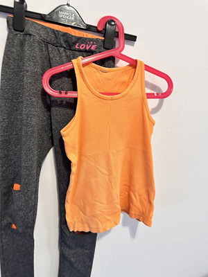 Girls' sports set with grey leggings and orange tank top, size 10
