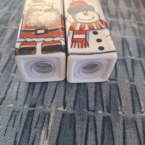 Salt and pepper set with Christmas snowman and Santa theme like new
