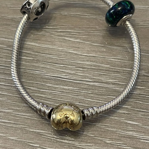 Pandora bracelet 925 silver with gold-plated clasp and two charms, used, 17 cm
