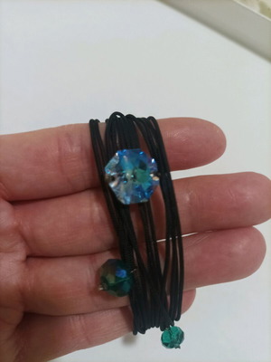 Bracelet like new with cords and crystals