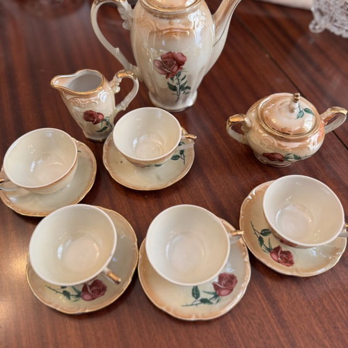 Vintage porcelain tea set with flowers and gold details, like new