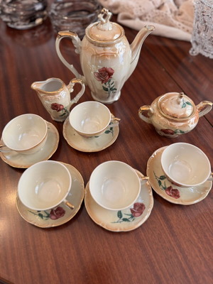 Vintage porcelain tea set with flowers and gold details, like new