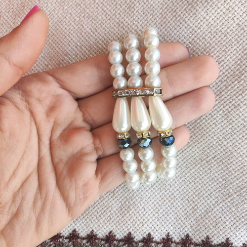 Classy bracelet with pearls triple row new, white and silver