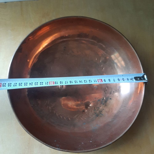 Large copper bowl used with carved details