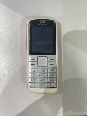 Nokia 5070 used, white, with battery, unknown working condition